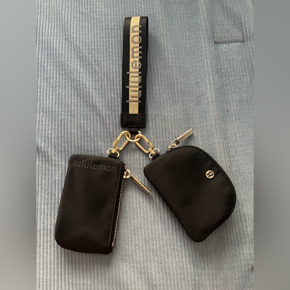 Gold and black Lululemon dual pouch